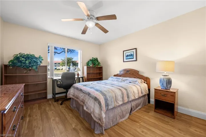 Bedroom with light wood-type flooring and ceiling fan