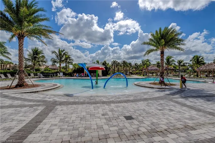 Community pool with a patio area