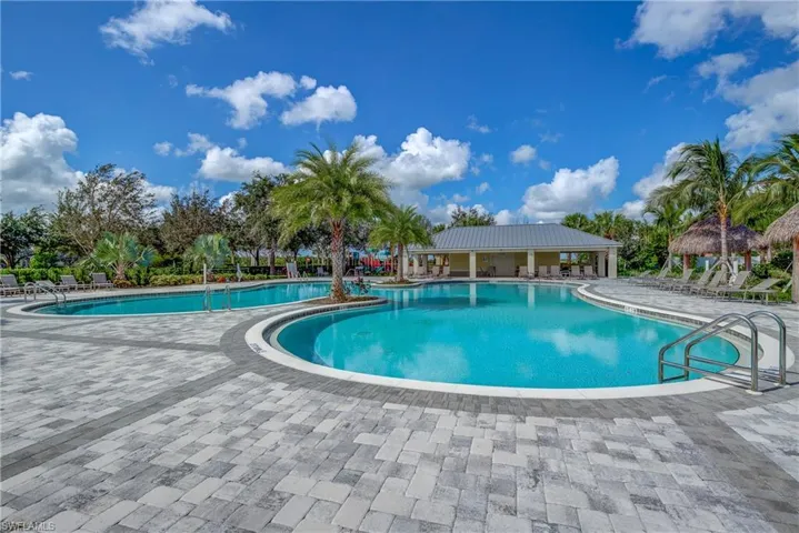 Community pool featuring a patio