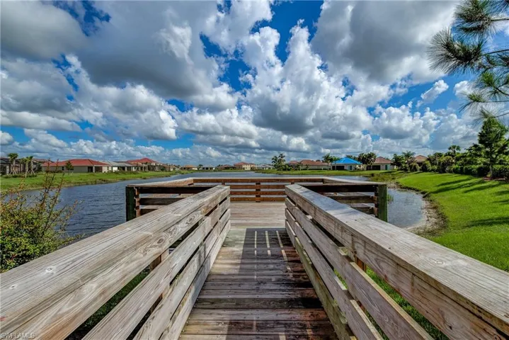 Dock area featuring a residential view and a water view