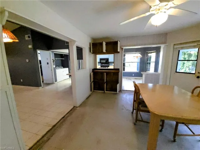 Dining room featuring washer and clothes dryer and ceiling fan