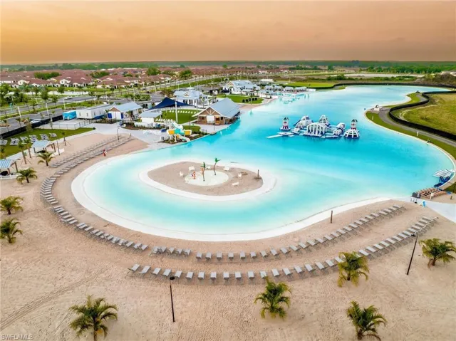 Pool at dusk with a water view