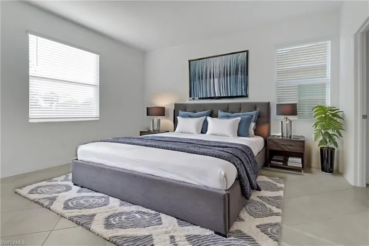 Bedroom with light tile patterned floors