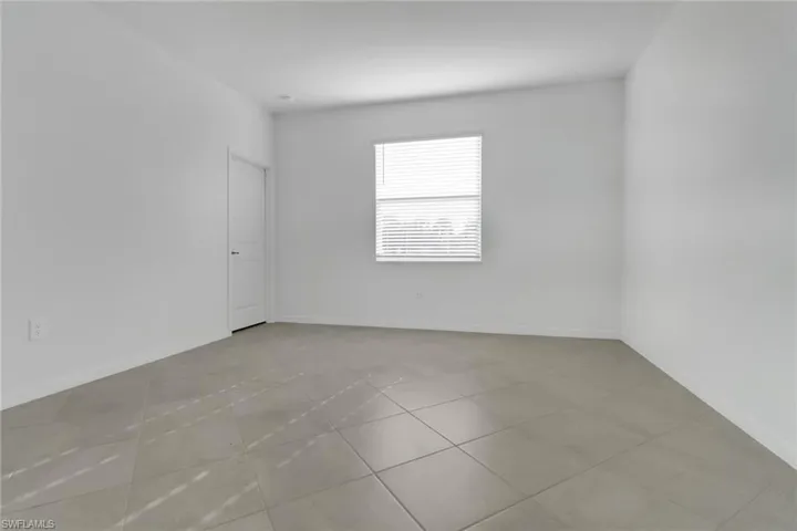 Unfurnished room featuring baseboards