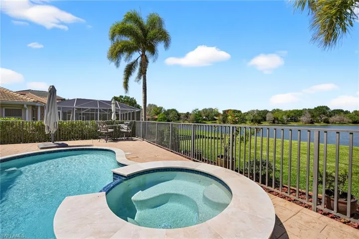 Combined pool / hot tub with a patio, outdoor dining area.