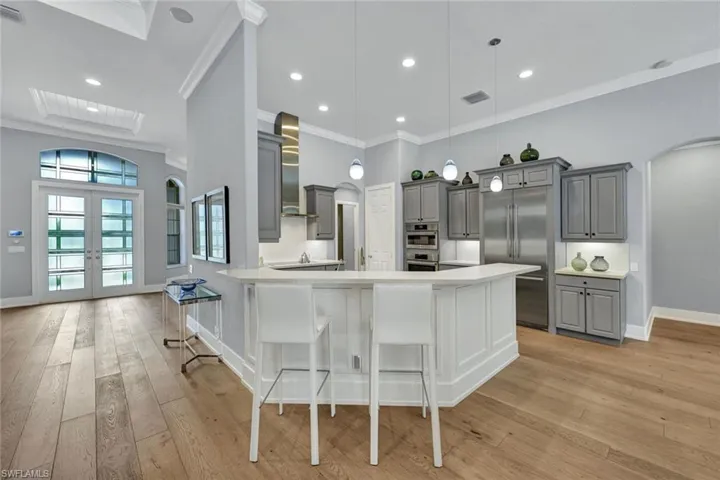 Warm Wide-Plank Wood Flooring Throughout