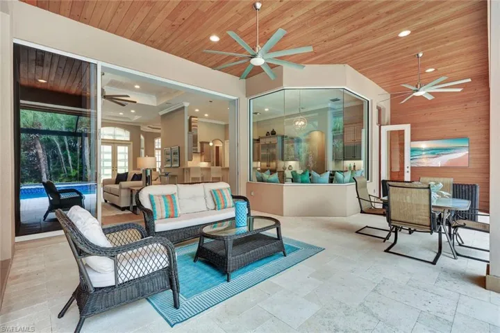 Indoor-Outdoor Living Enhanced by Wood Paneling on Lanai