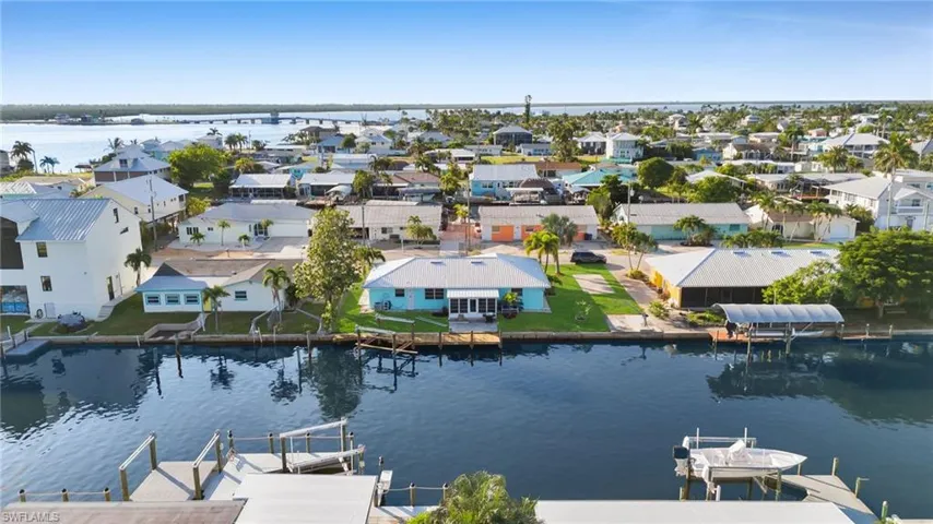 Aerial view of residential area with a nearby body of water