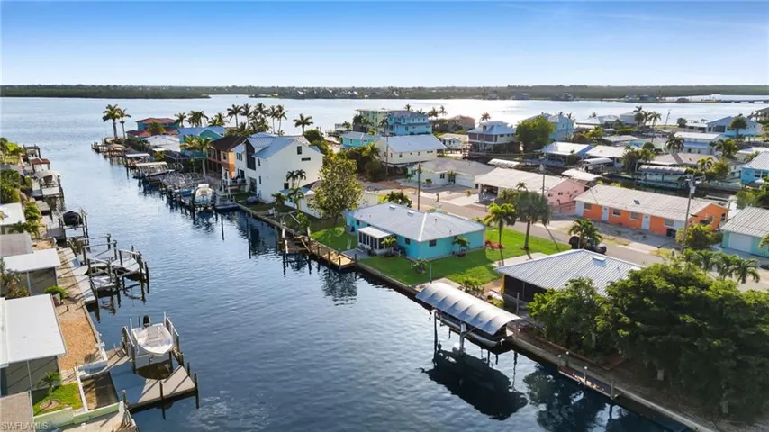 Aerial perspective of suburban area with a large body of water