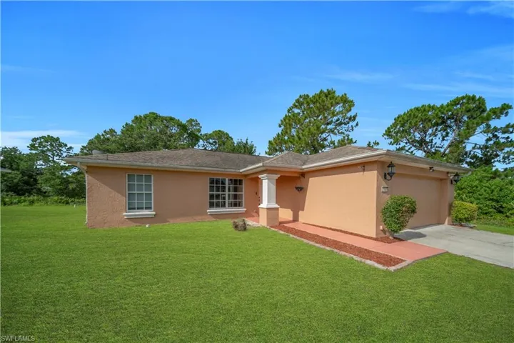 Stucco exterior residence with a two-car garage