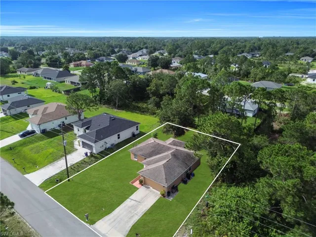 Single-story residence with a two-car garage and a paved driveway