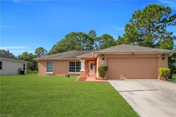Single-story property featuring a stucco exterior, an attached two-car garage, and a concrete driveway