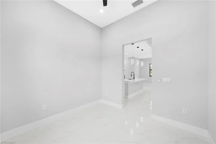 Empty room with light tile floors
