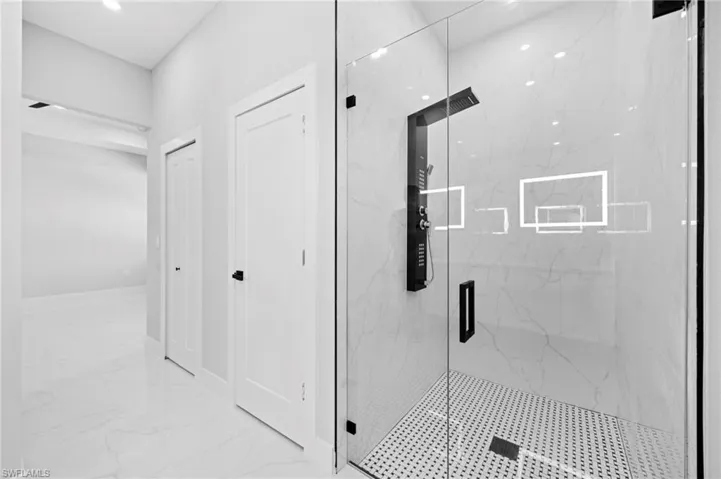 Bathroom with tile floors and walk in shower