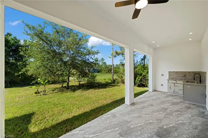 View of patio featuring sink and ceiling fan