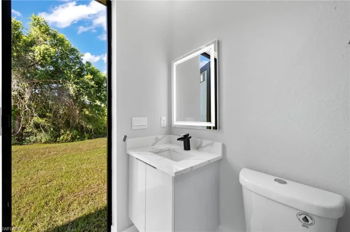 Bathroom with oversized vanity and toilet