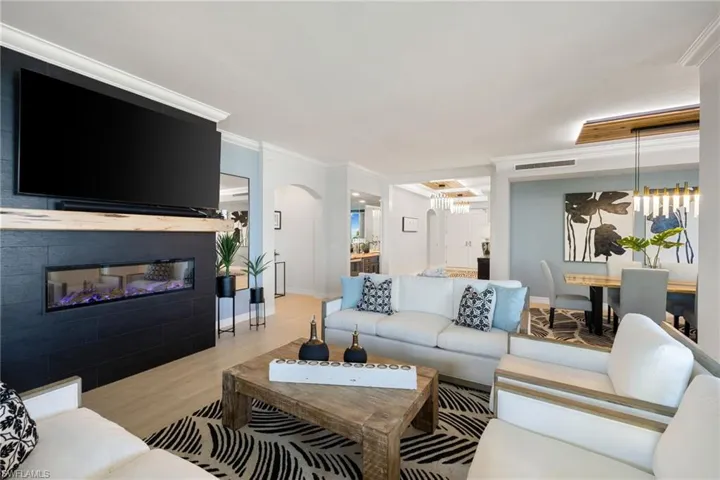 Family room featuring ornamental molding and light wood-type flooring