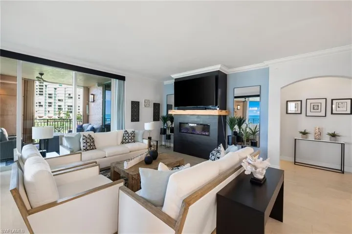 Family room with crown molding and light hardwood / wood-style flooring