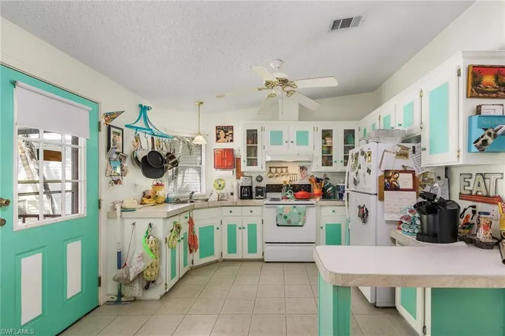 Kitchen with plenty of cabinets and breakfast bar