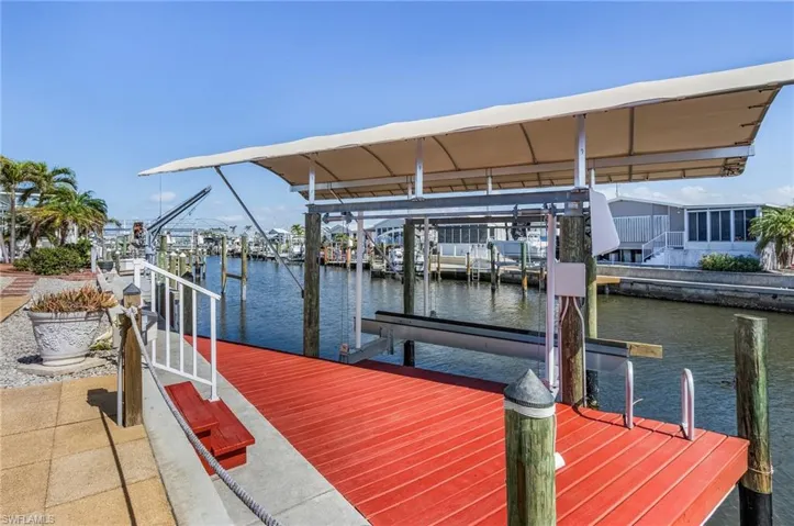 Boat lift with new canvas cover, cradle, bunks, and cables