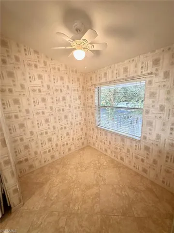 Spare room with a ceiling fan