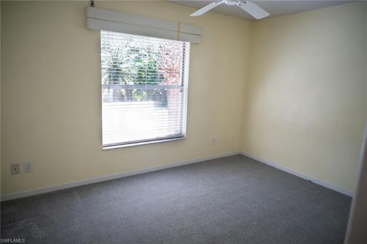 Unfurnished 2nd bedroom featuring carpet and ceiling fan