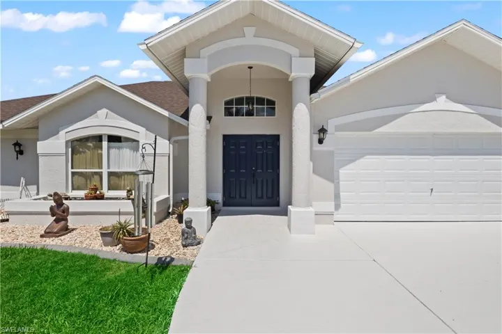 Property entrance featuring a garage