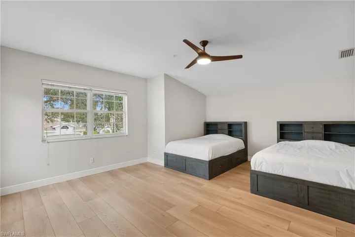 Unfurnished bedroom with light hardwood / wood-style flooring and ceiling fan