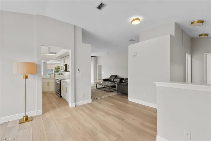 Hall featuring light hardwood / wood-style floors and sink