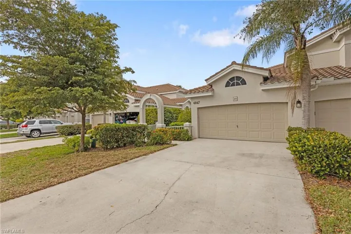 Mediterranean / spanish-style house with a garage