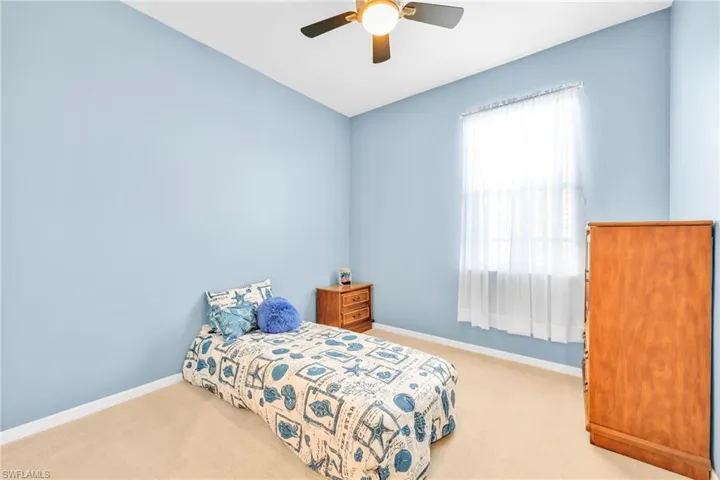 Bedroom with carpet flooring and ceiling fan