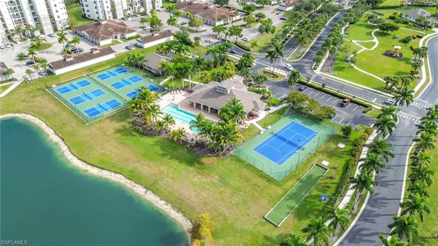 Aerial view of property and surrounding area featuring a pool