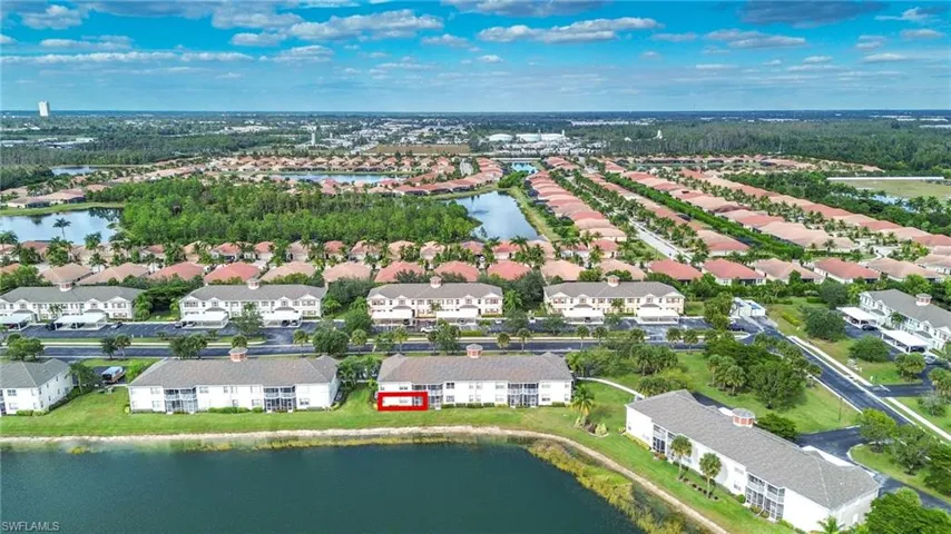 View of property location with a large body of water and nearby suburban area