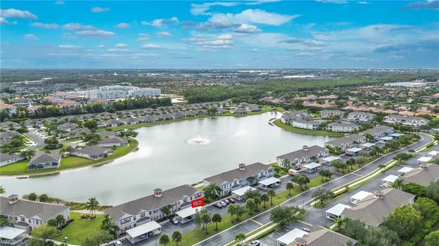 Aerial view of property's location with nearby suburban area