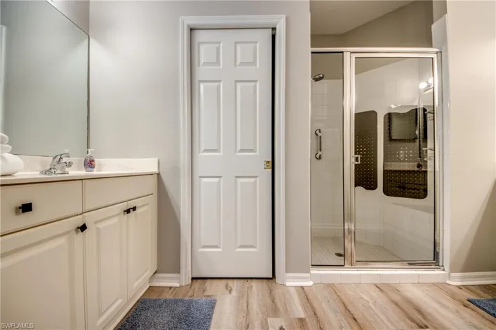 Primary bathroom with two sinks and vanities