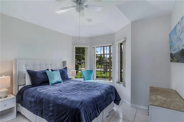 Bedroom featuring ceiling fan and light tile patterned floors