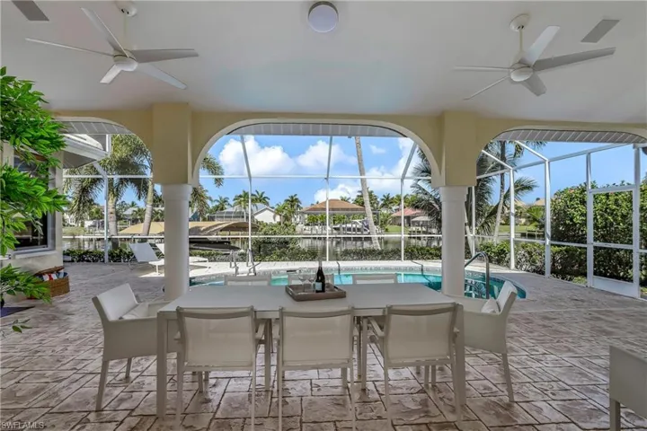 View of patio / terrace with glass enclosure and ceiling fan