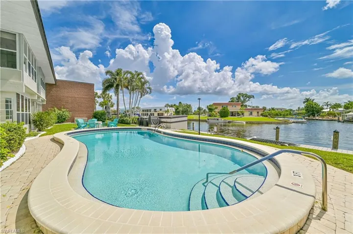 View of pool featuring a water view