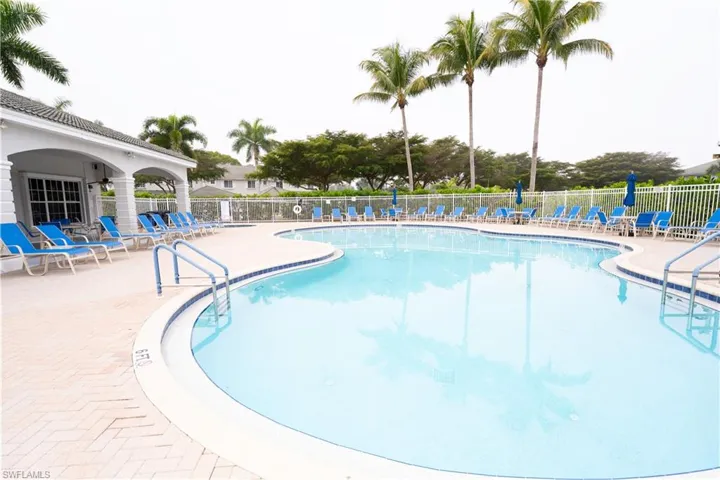 Community pool featuring a patio