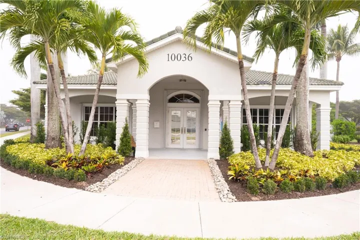 Property entrance with french doors, stucco siding, and a tiled roof