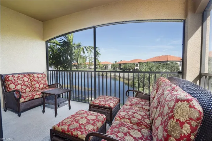 Sunroom / solarium with a water view