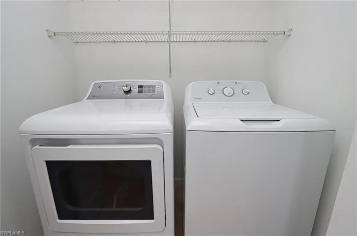 Laundry room featuring separate washer and dryer