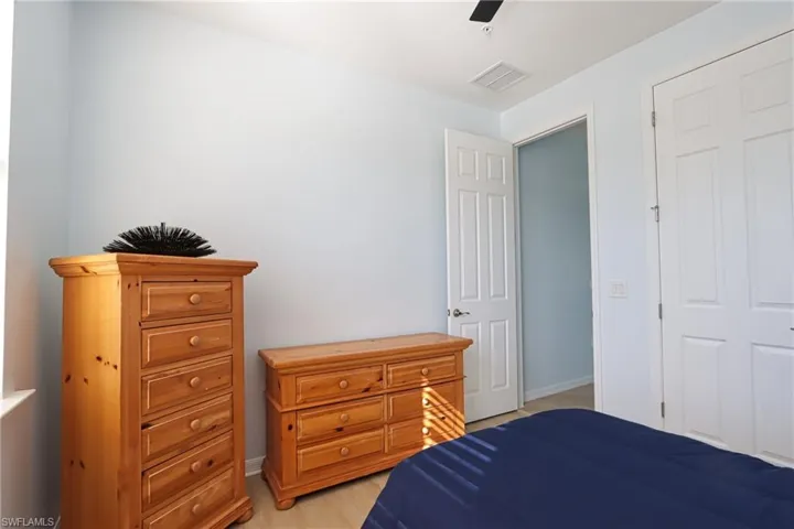Bedroom featuring light hardwood / wood-style flooring and ceiling fan