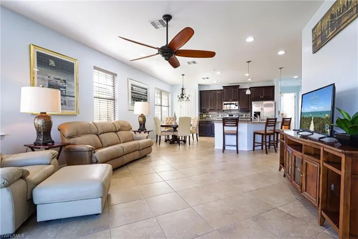 Tiled living room with ceiling fan