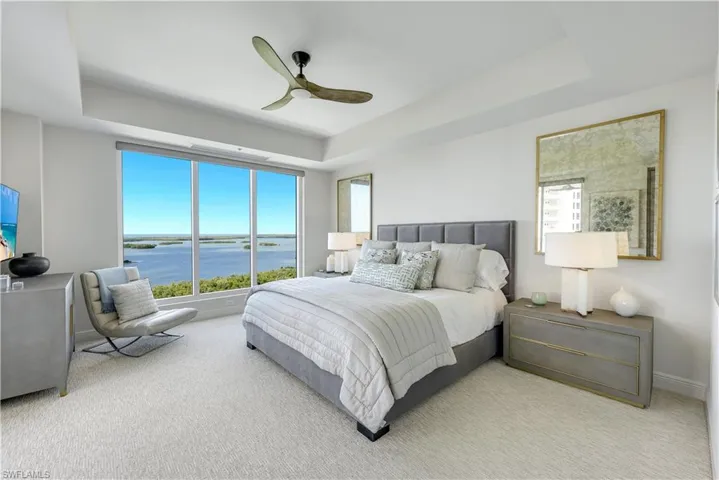 The primary bedroom has ample space offers a relaxing atmosphere and a spectacular view.