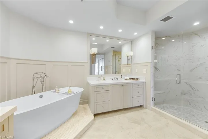 Custom sconces and wood paneling are a lovely finishing touch.