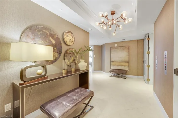 Step off the elevator into a space defined by neutral tones and thoughtfully appointed furnishings.