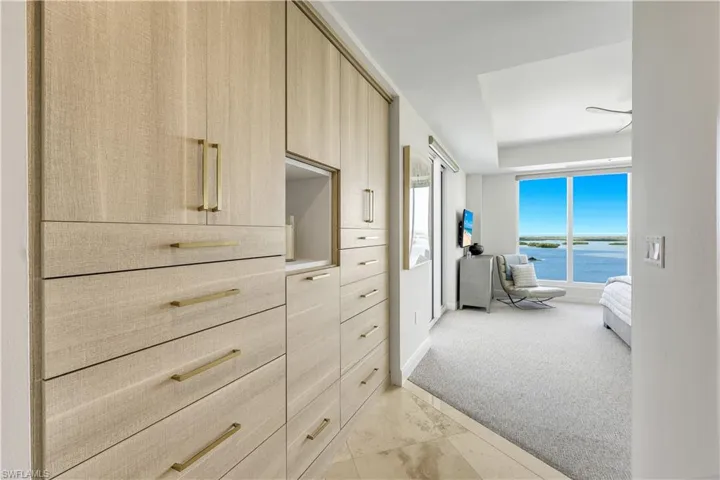 The sophisticated built in storage cabinet complements the spacious walk-in closet.