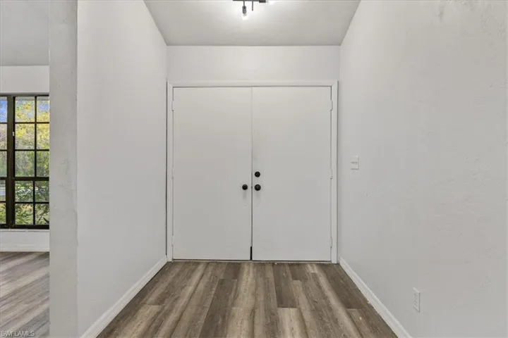 Foyer with hardwood / wood-style floors