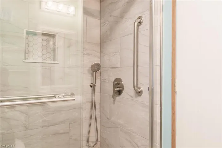 Bathroom with a shower with door